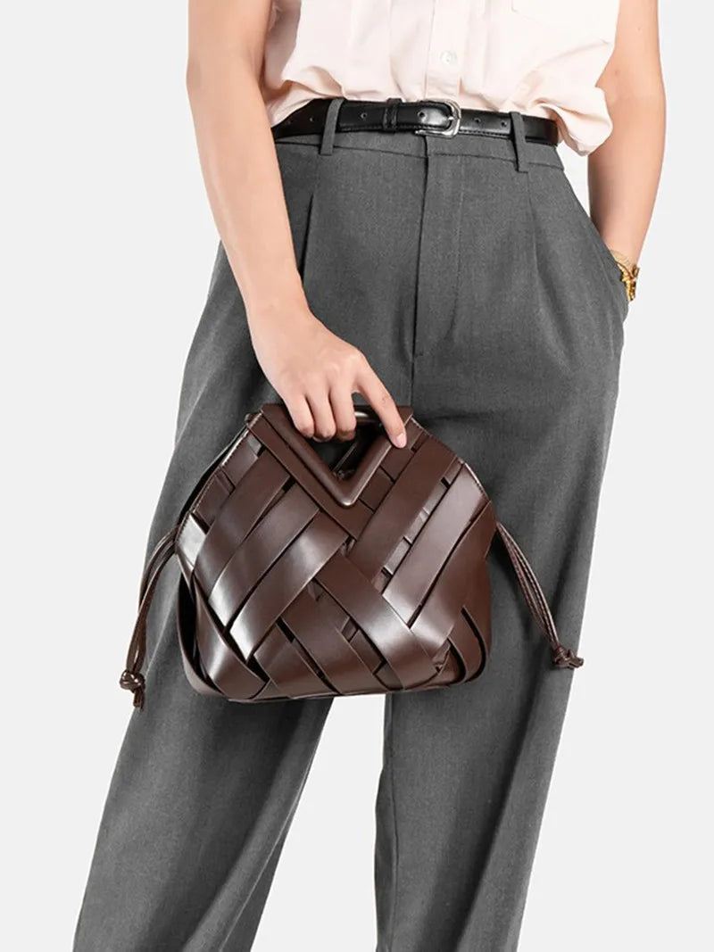 2024 novo design de luxo moda tecido bolsa couro genuíno francês portátil retro tendência bolsa ombro oco para fora balde saco