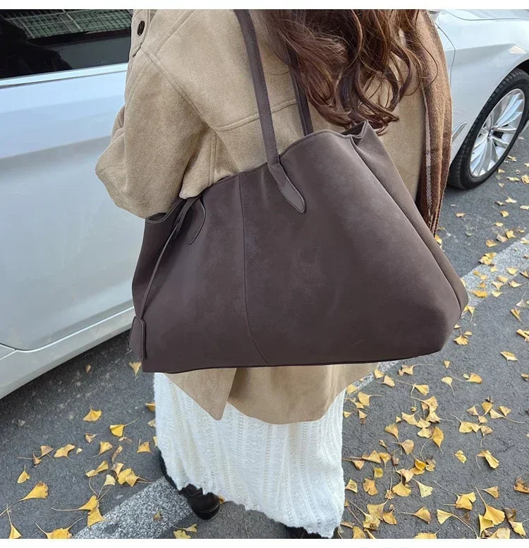 Cor sólida venda quente camurça falsa moda versátil bolsa 2025 produto de alta qualidade grande capacidade sacos de ombro femininos