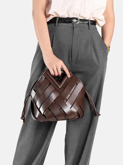 2024 novo design de luxo moda tecido bolsa couro genuíno francês portátil retro tendência bolsa ombro oco para fora balde saco