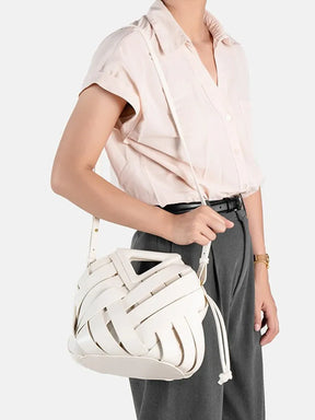 2024 novo design de luxo moda tecido bolsa couro genuíno francês portátil retro tendência bolsa ombro oco para fora balde saco