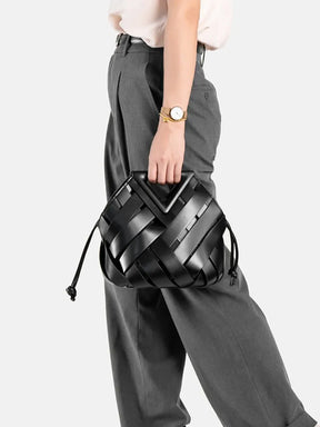 2024 novo design de luxo moda tecido bolsa couro genuíno francês portátil retro tendência bolsa ombro oco para fora balde saco