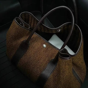 Novo nicho pequeno alto nível de aparência moda feminina temperamento lã ombro único carregando grande saco tudo-em-um mochila